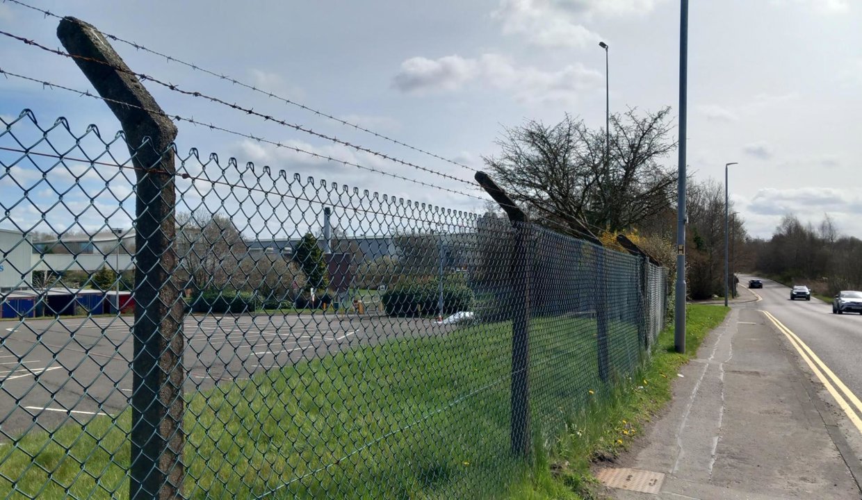 fencing running along side of road