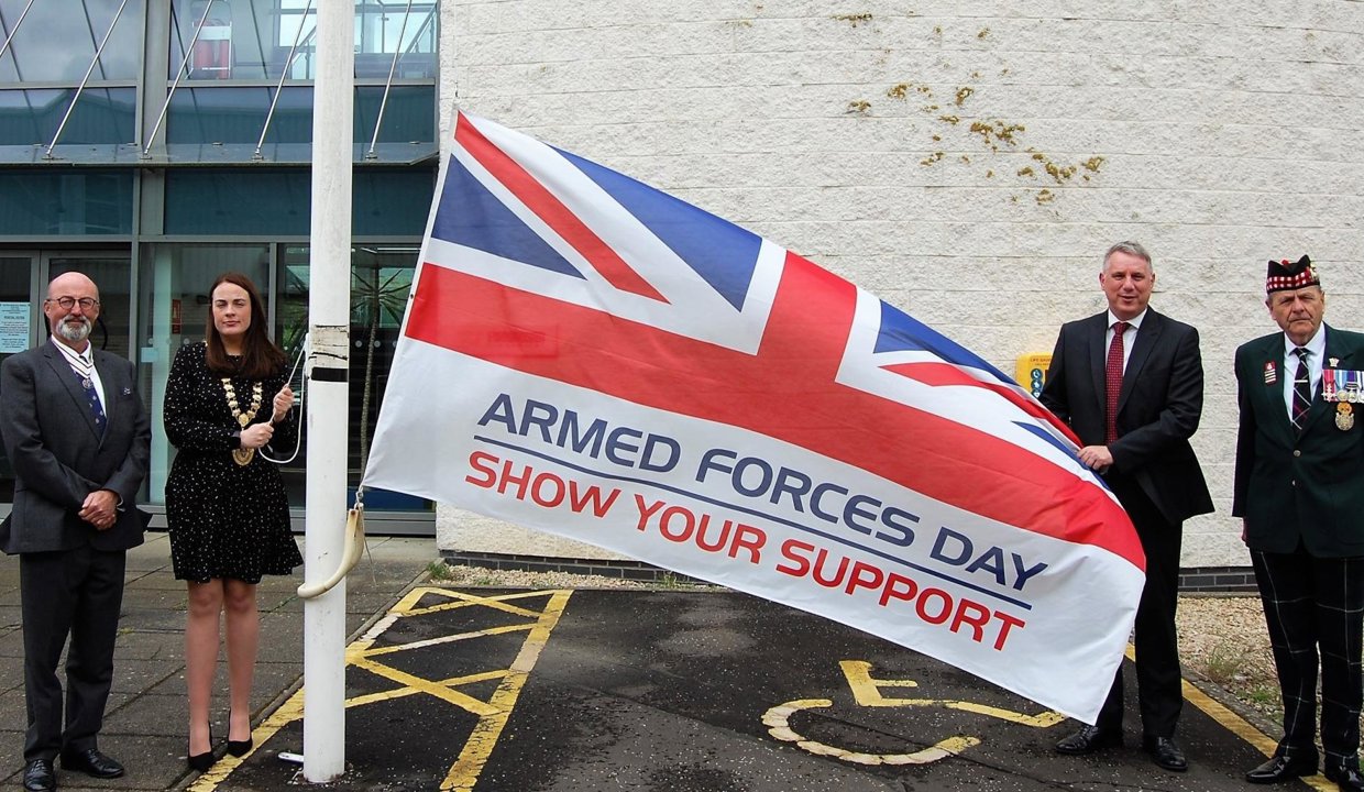 Pictured - with the Armed Forces Day flag - Vice Lord-Lieutenant Jim Rogers, Depute Provost Colette McDiarmid, Councillor Stewart MacDonald and local veteran Robert Campbell MBE.