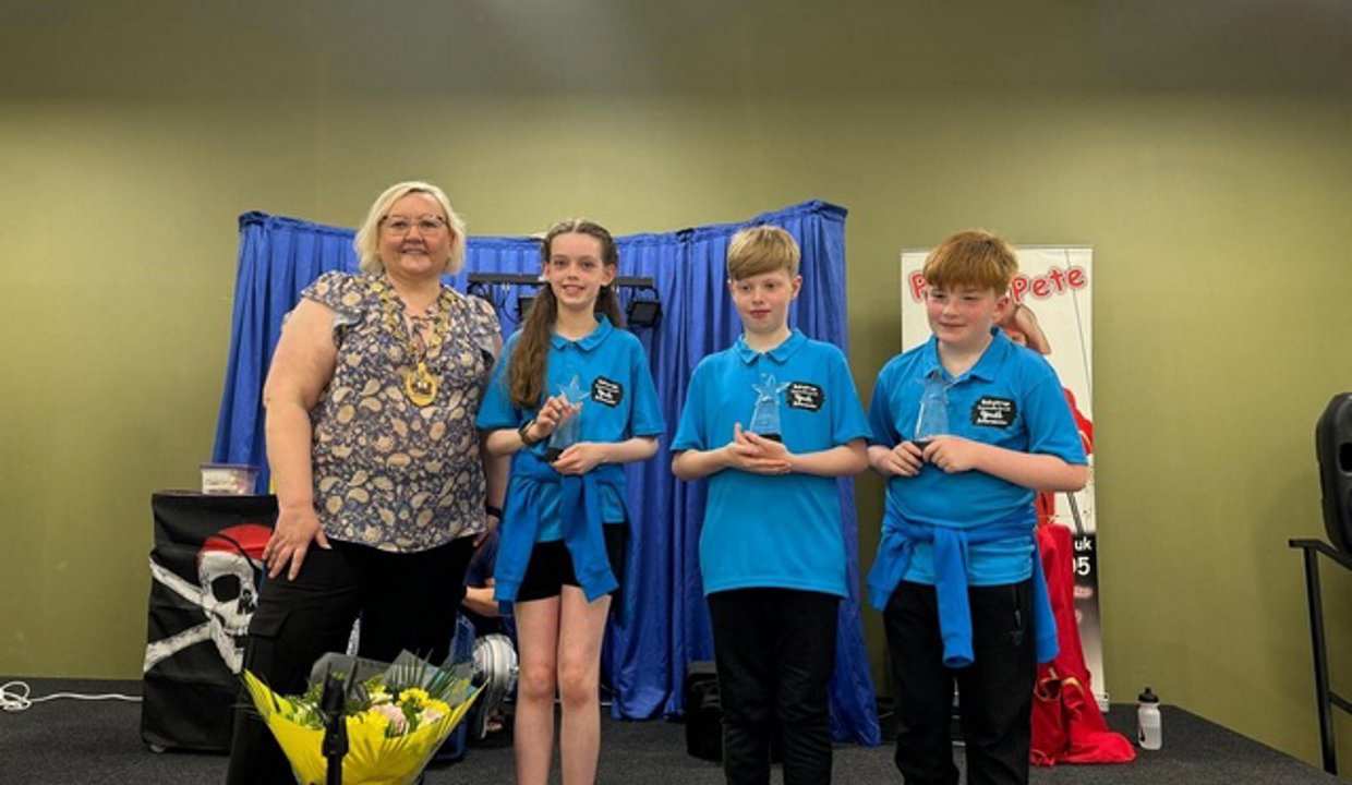 Provost is pictured with the three new Youth Ambassadors
