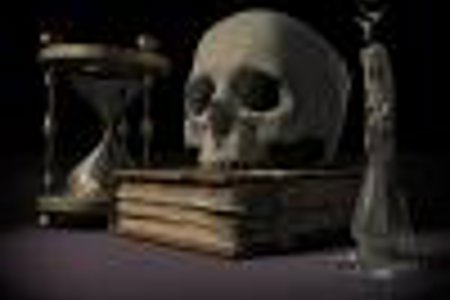 skull sitting on top of books