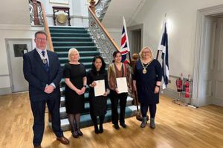 Provost Gillian Renwick with Deputy Lieutenant Mark Billington and new citizens.