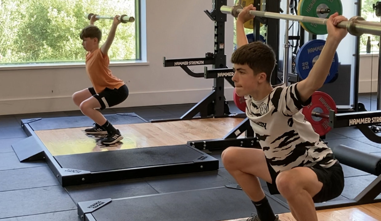 Findlay and Max lifting weights in the gym