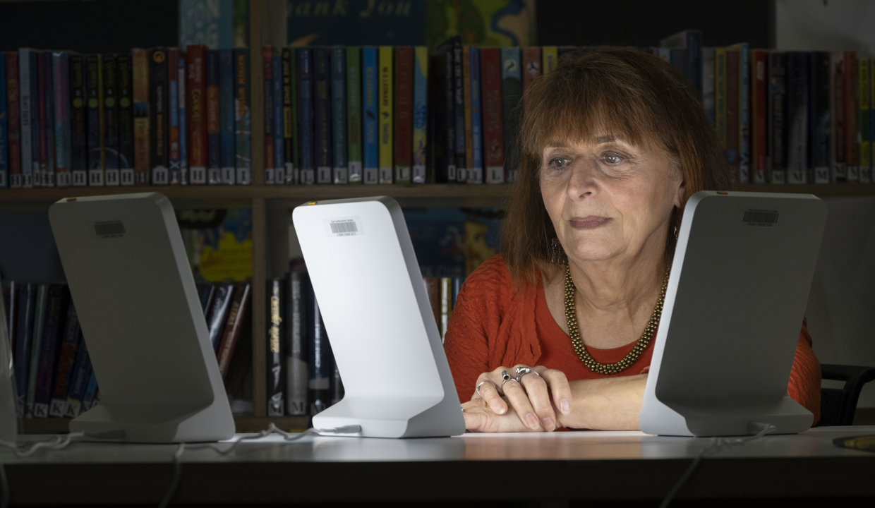 Claire Charlwood is pictured using one of the SAD lamps in William Patrick Library in Kirkintilloch.