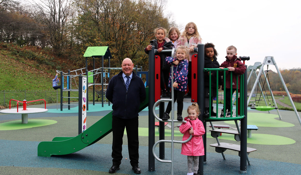 Children standing on equipment in the new play park