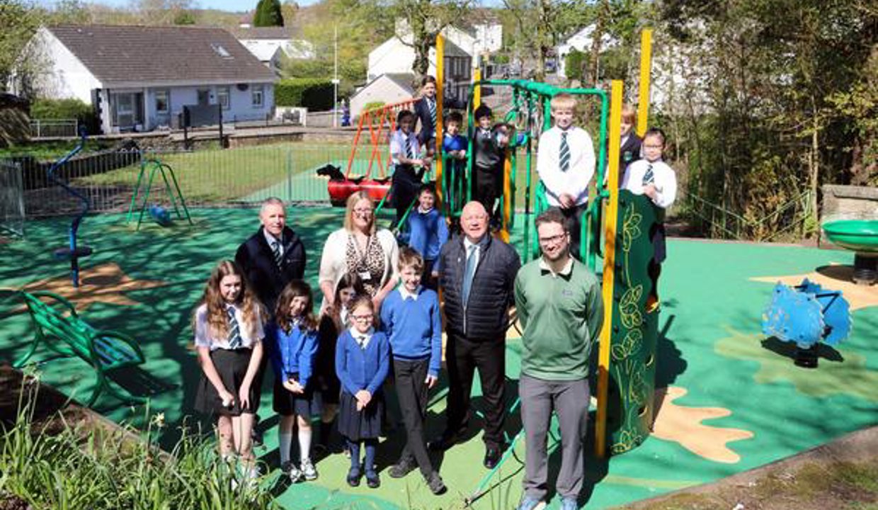 Teachers, pupils and Councillor Ferretti in the play park